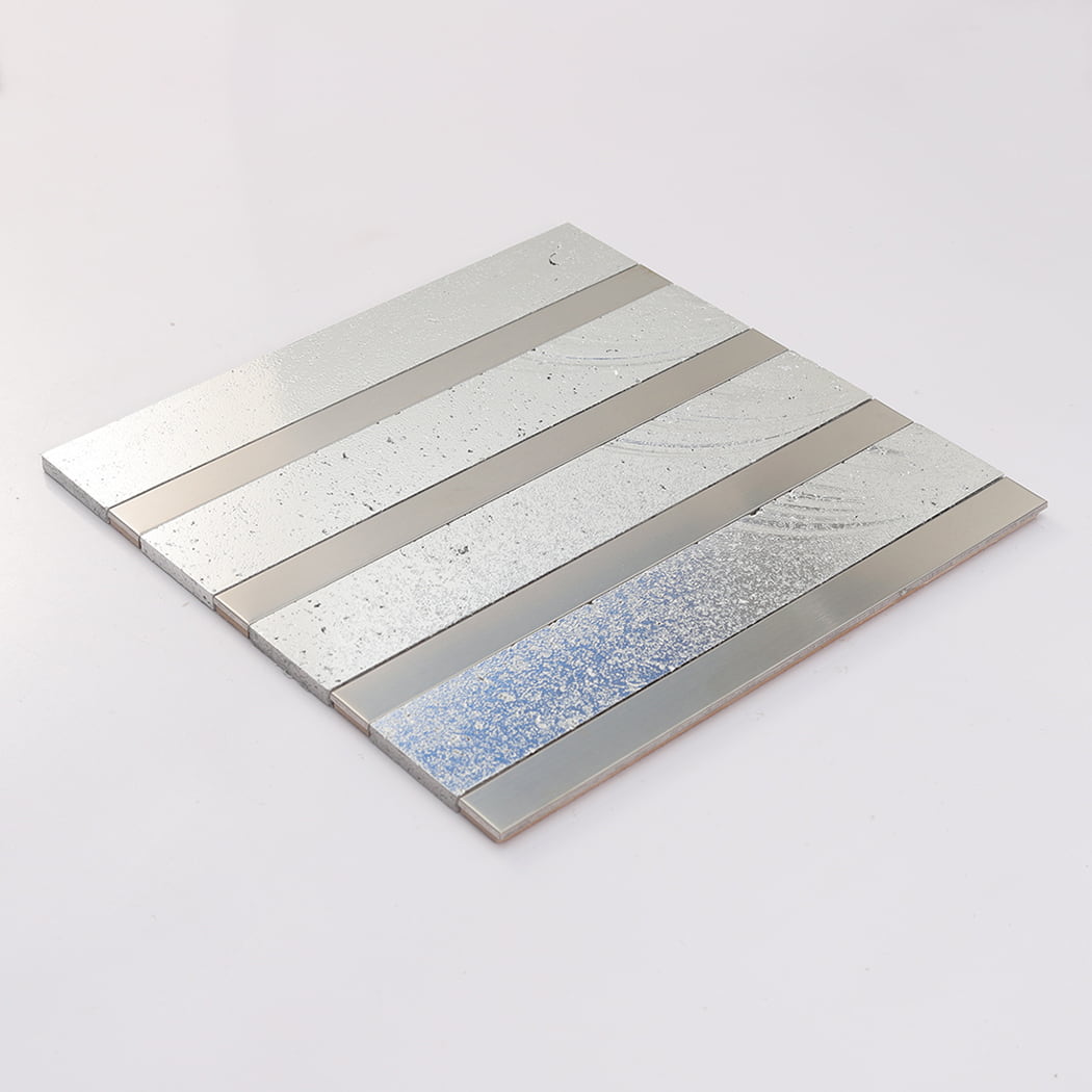 Angled view of silver electroplated stone tile with brushed stainless steel strips