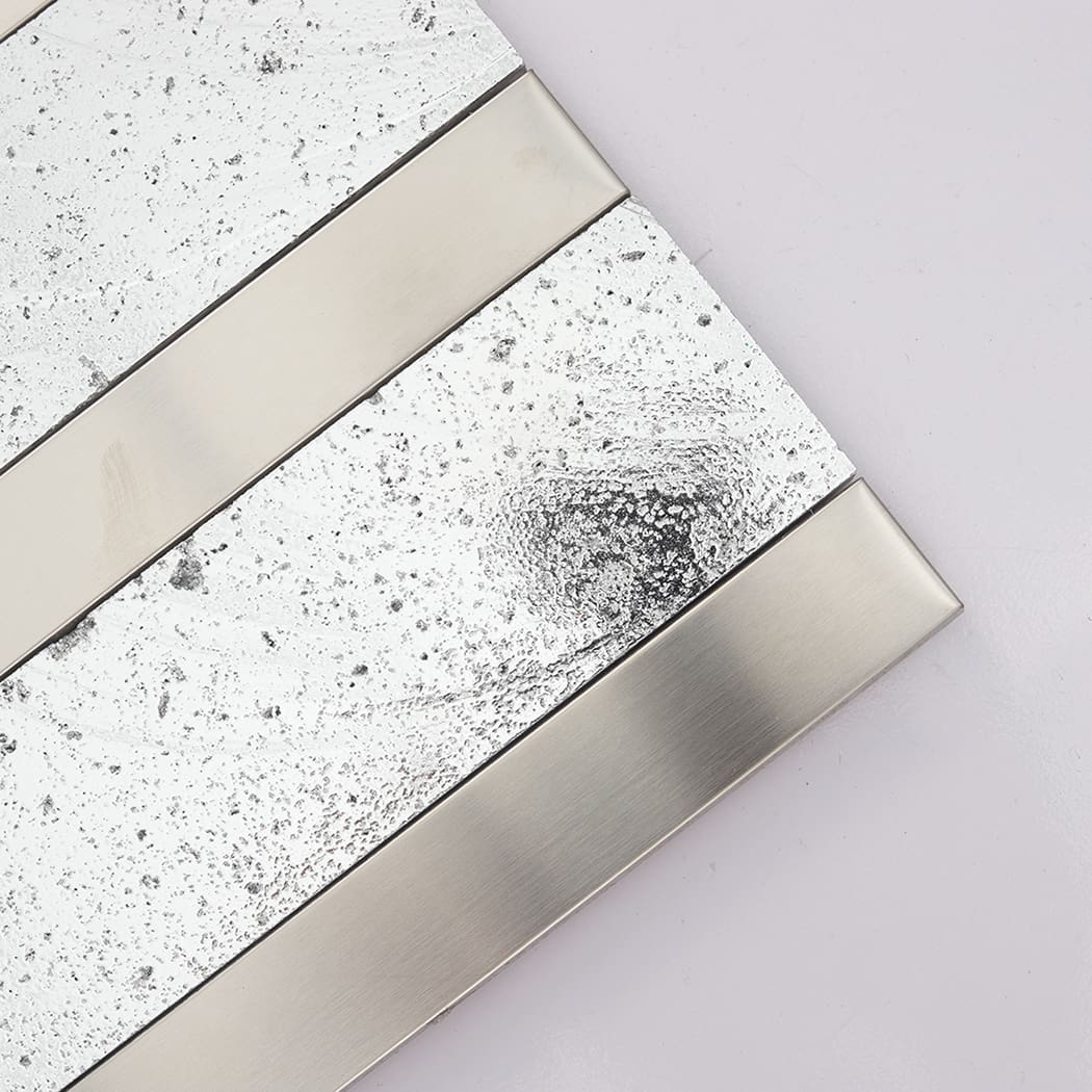 Close-up of silver electroplated stone with smooth brushed stainless steel trim