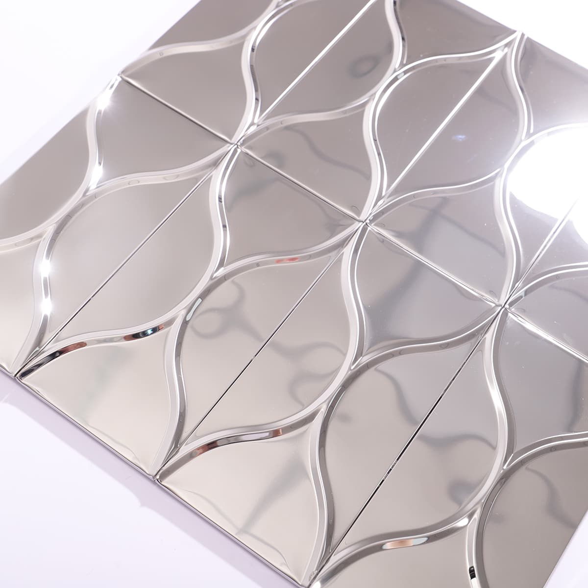 Close-up of silver stainless wave mosaic tile