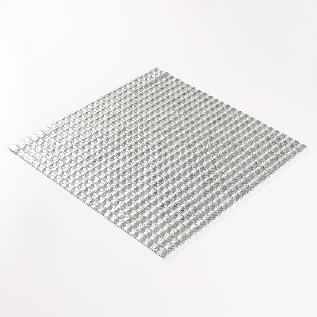 High-angle slanted view of a square clear glass mosaic tile sheet on white.