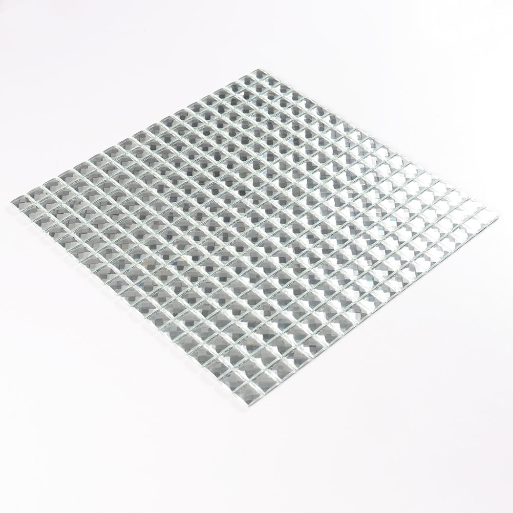 Slanted isometric view of a complete sheet of silver mirror glass mosaic tiles.