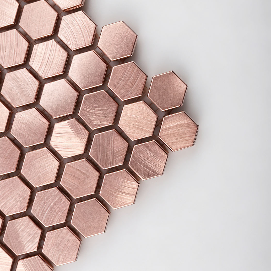 Corner detail showing brushed texture of rose gold hexagon tile