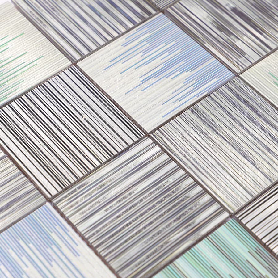 Diagonal view of square aluminum linear textured mosaic tile arrangement