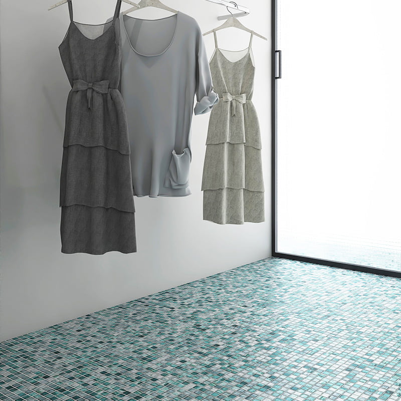 Square floor tiles with green glass mosaic pattern in a bright room