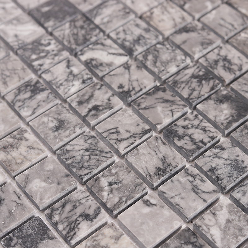 Detailed texture of grey square marble tiles in grid pattern