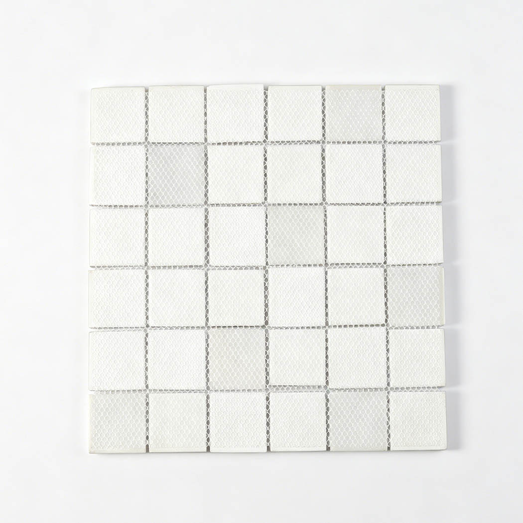 White mesh backing view of square mosaic tile sheet