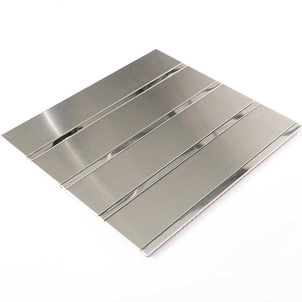 Angled view of stainless steel linear mirror mosaic tile panel.