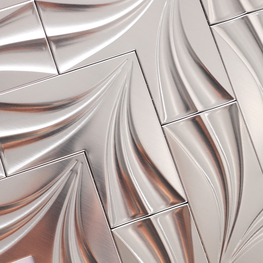 Close-up of brushed stainless steel chevron mosaic texture