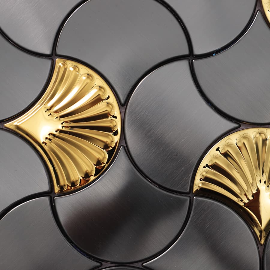 Surface view of black and gold stainless steel fan mosaic tile pattern