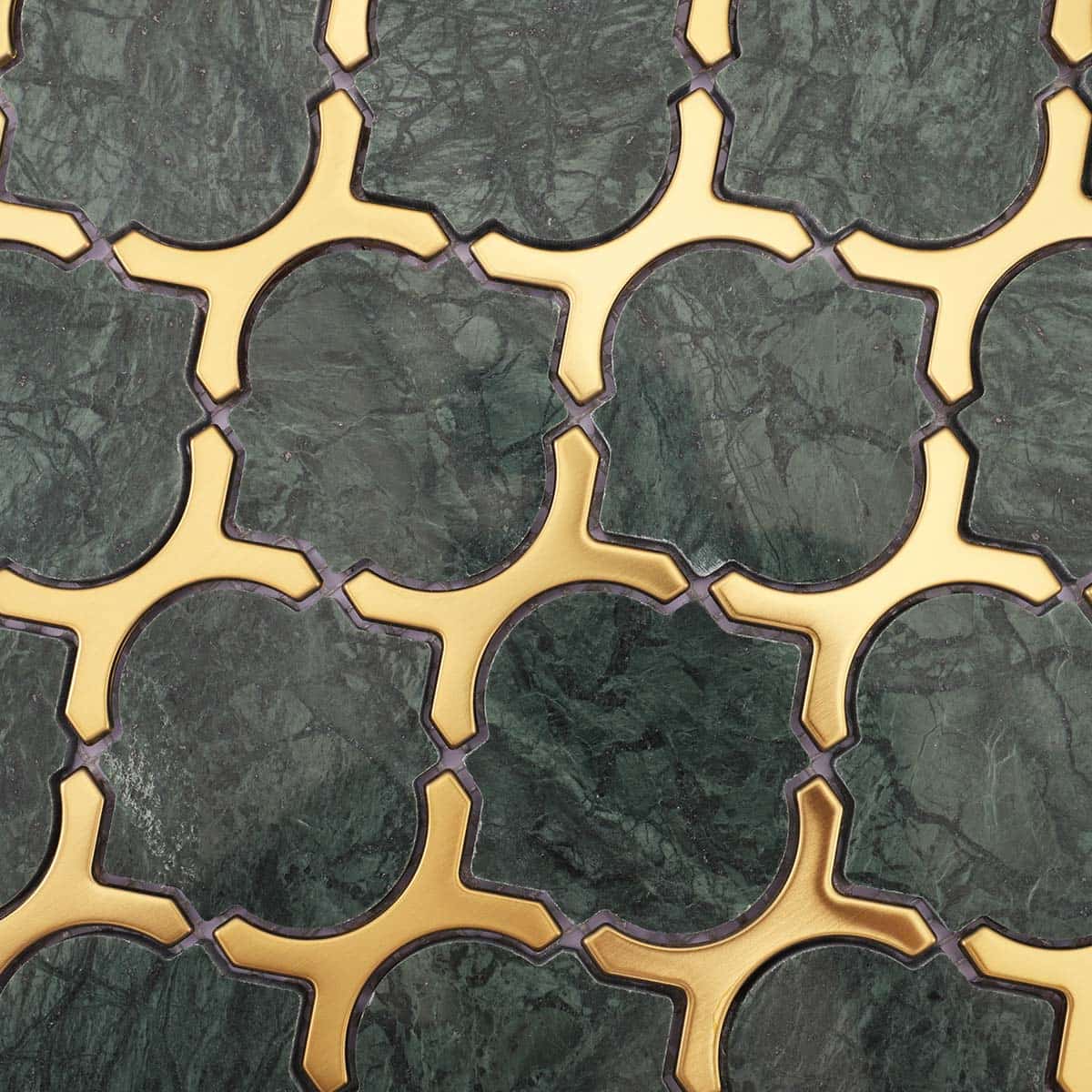 Surface detail of green marble with gold stainless inlay