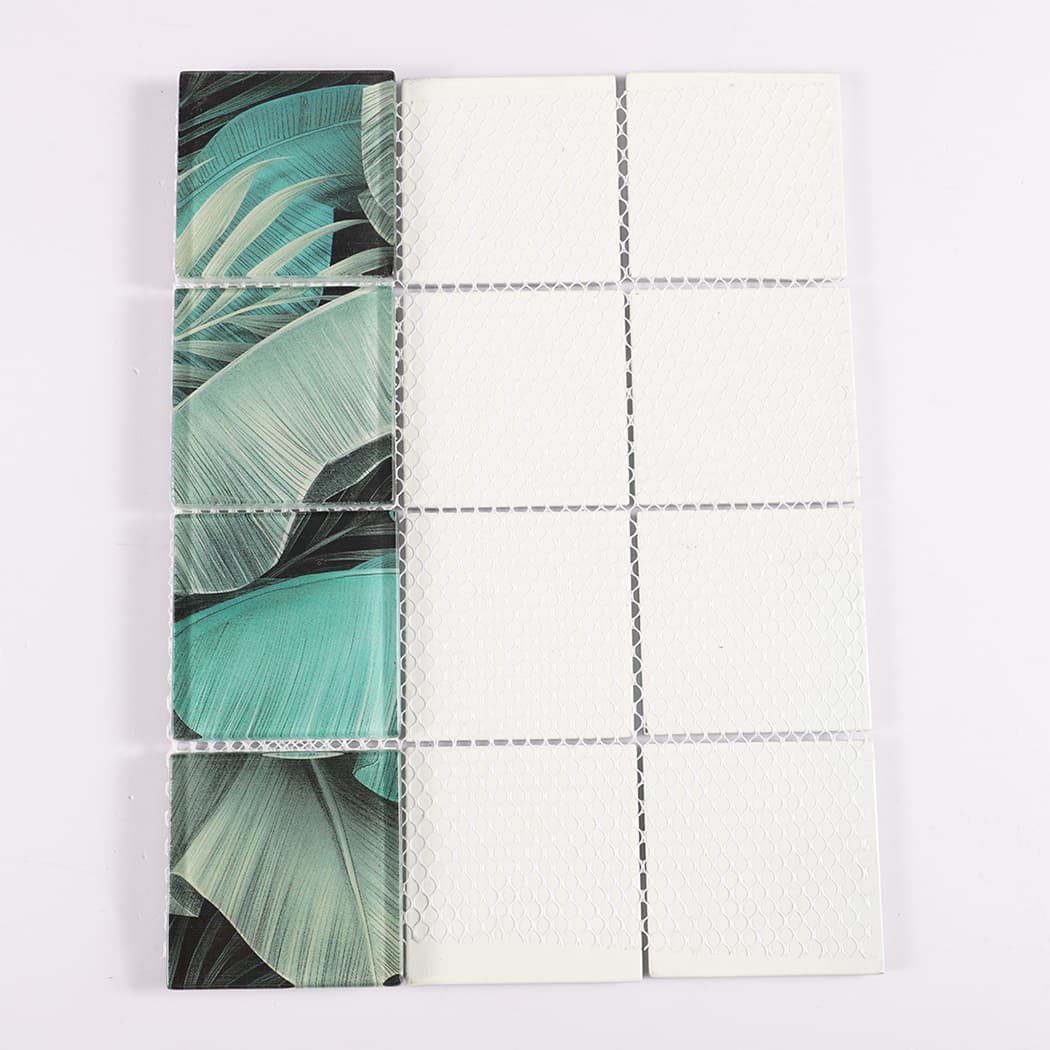 Mesh backing of teal and gray tropical leaf square glass mosaic tile sheet