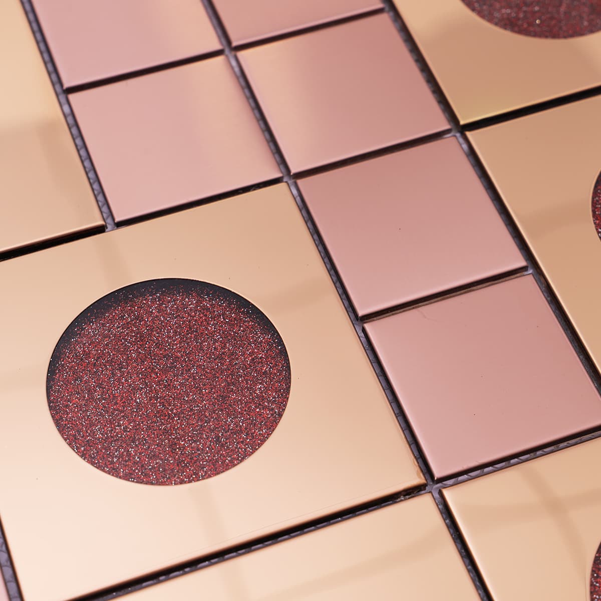 Texture view of rose gold metal and glitter circle glass mosaic