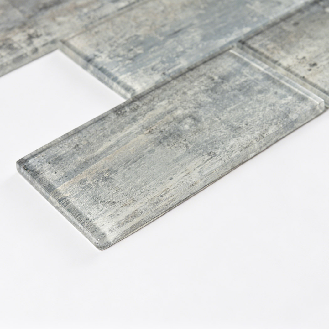 Close up corner view highlighting the rustic stone and concrete texture of glass tile.