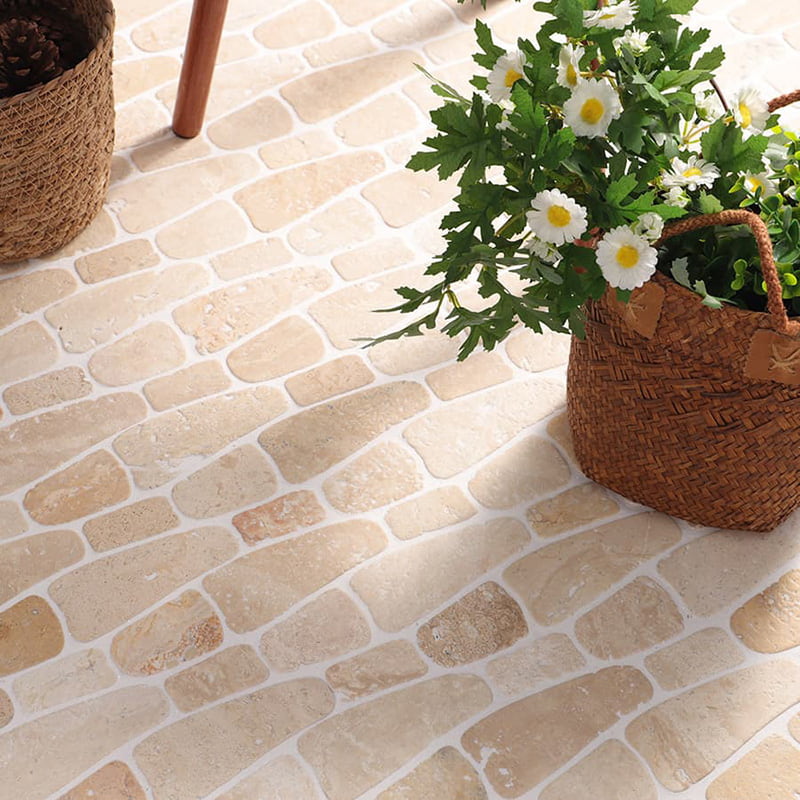 Travertine marble tiles natural stone floor with plants in woven basket