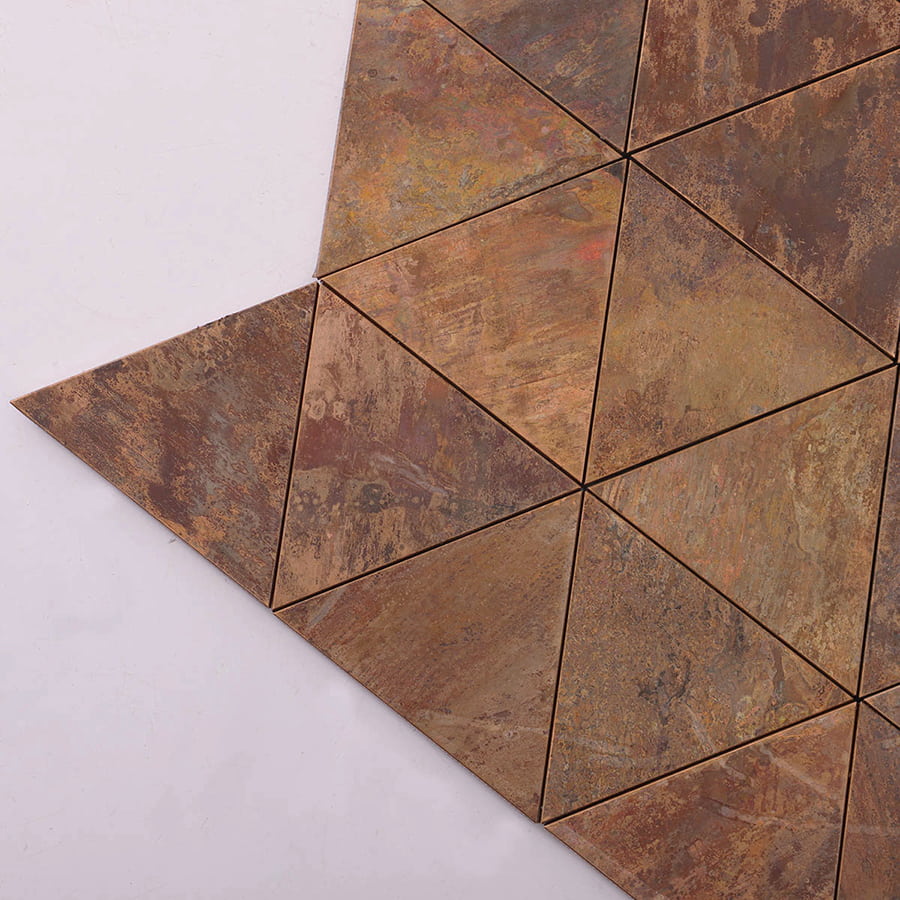 Corner detail of triangle copper metal mosaic tile