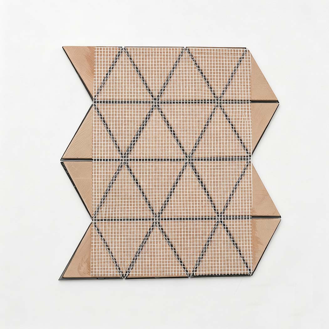 Back view of triangle mosaic shower tile sheet with mesh backing