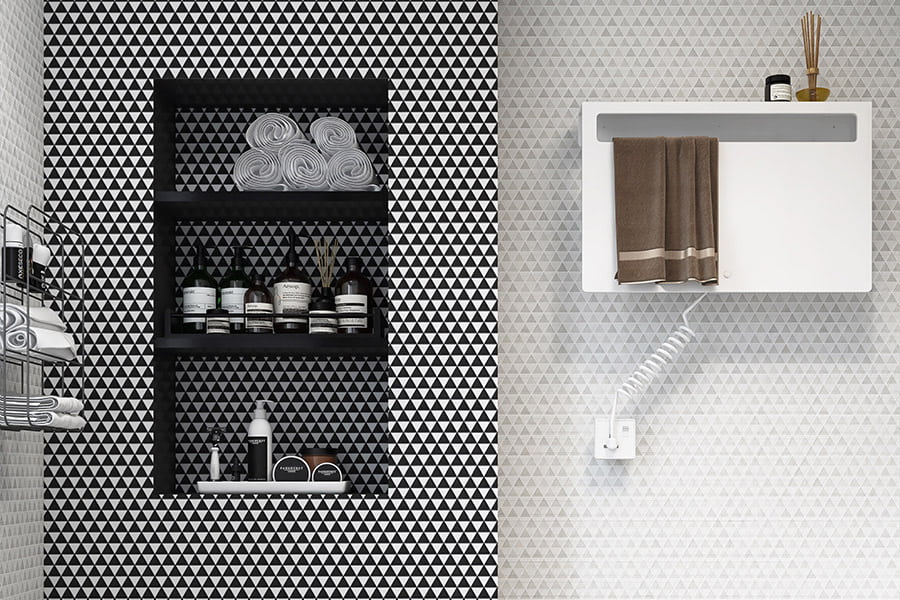 Geometric triangle tile backsplash in black and white bathroom design