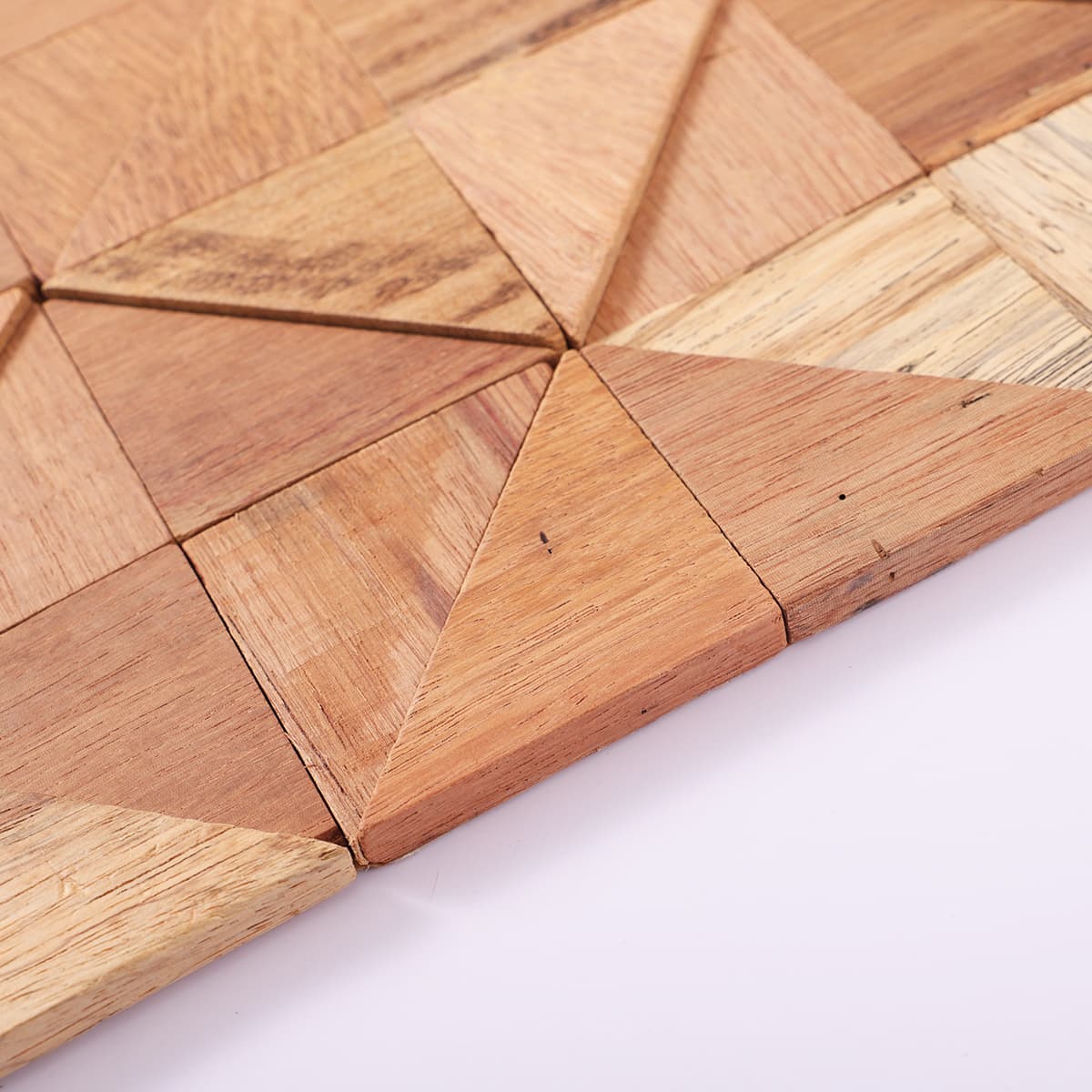 Side angle of triangle wood mosaic showing layered pattern