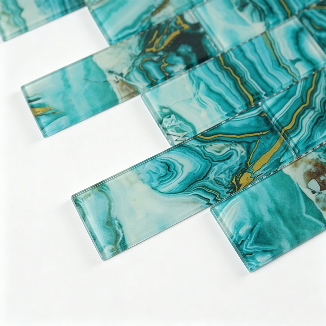 Angled turquoise glass subway tile sample with layered agate bands and gold veins