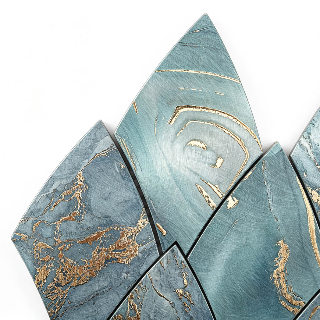 Top angle view of turquoise and gold leaf shape metallic tile corner