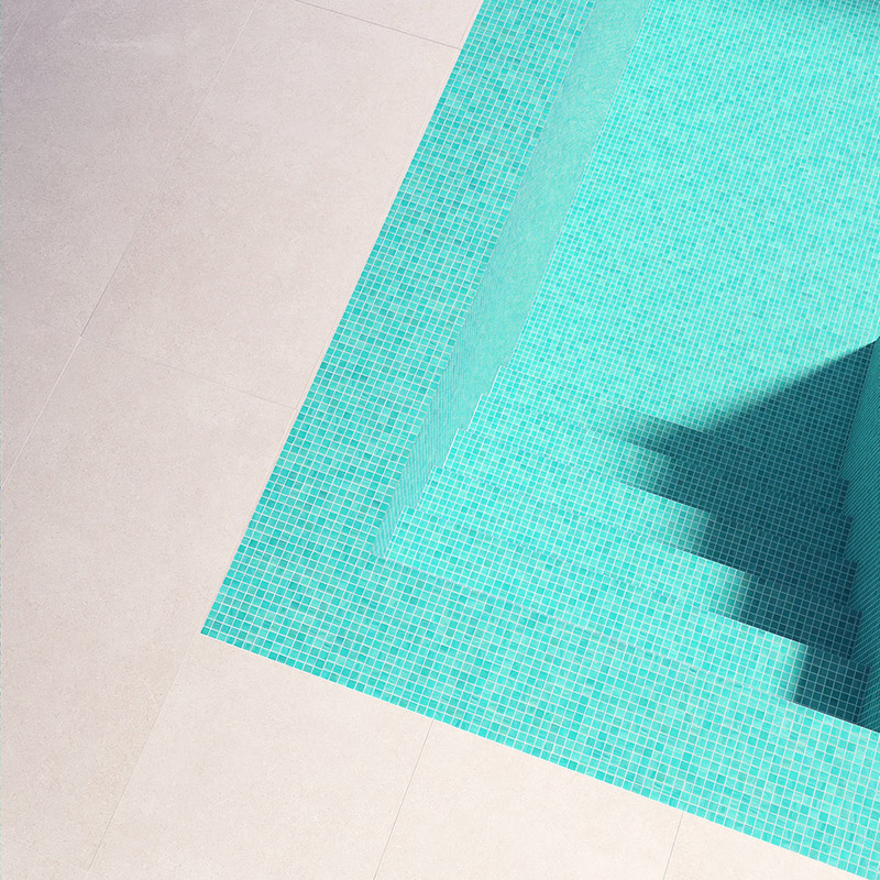 Turquoise swimming pool tiles with sunlit steps showing elegant modern pool design
