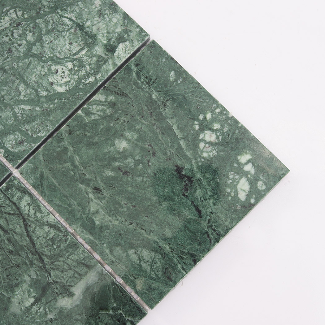 Close up of verde green marble square tile with rich stone patterns