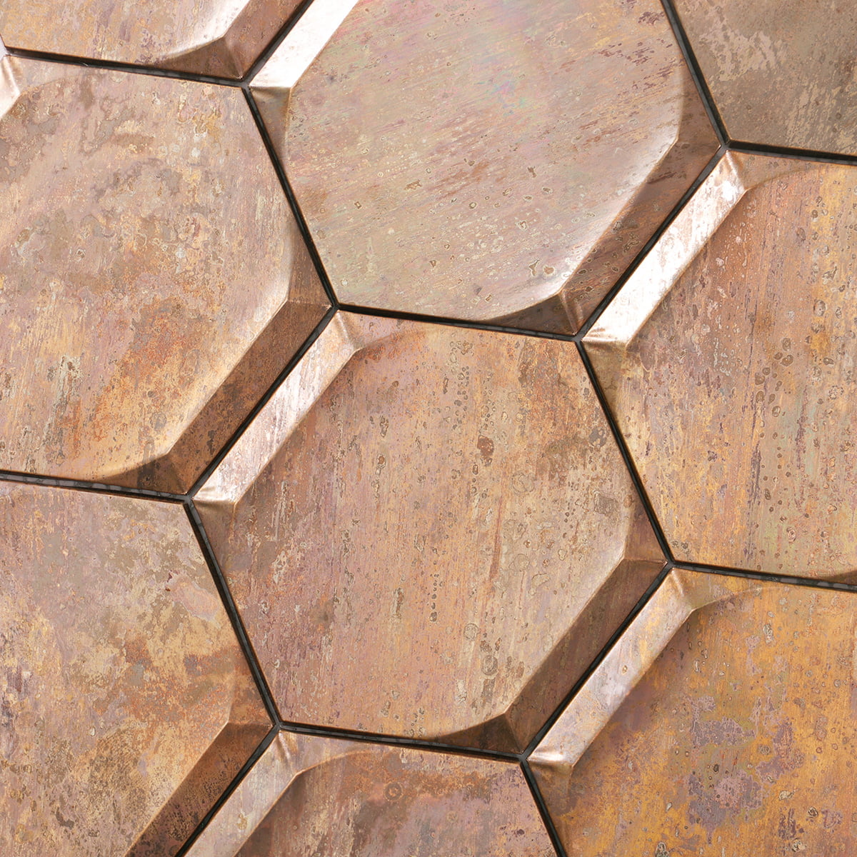 Close-up of vintage bronze hexagon mosaic tiles highlighting intricate surface details and patina