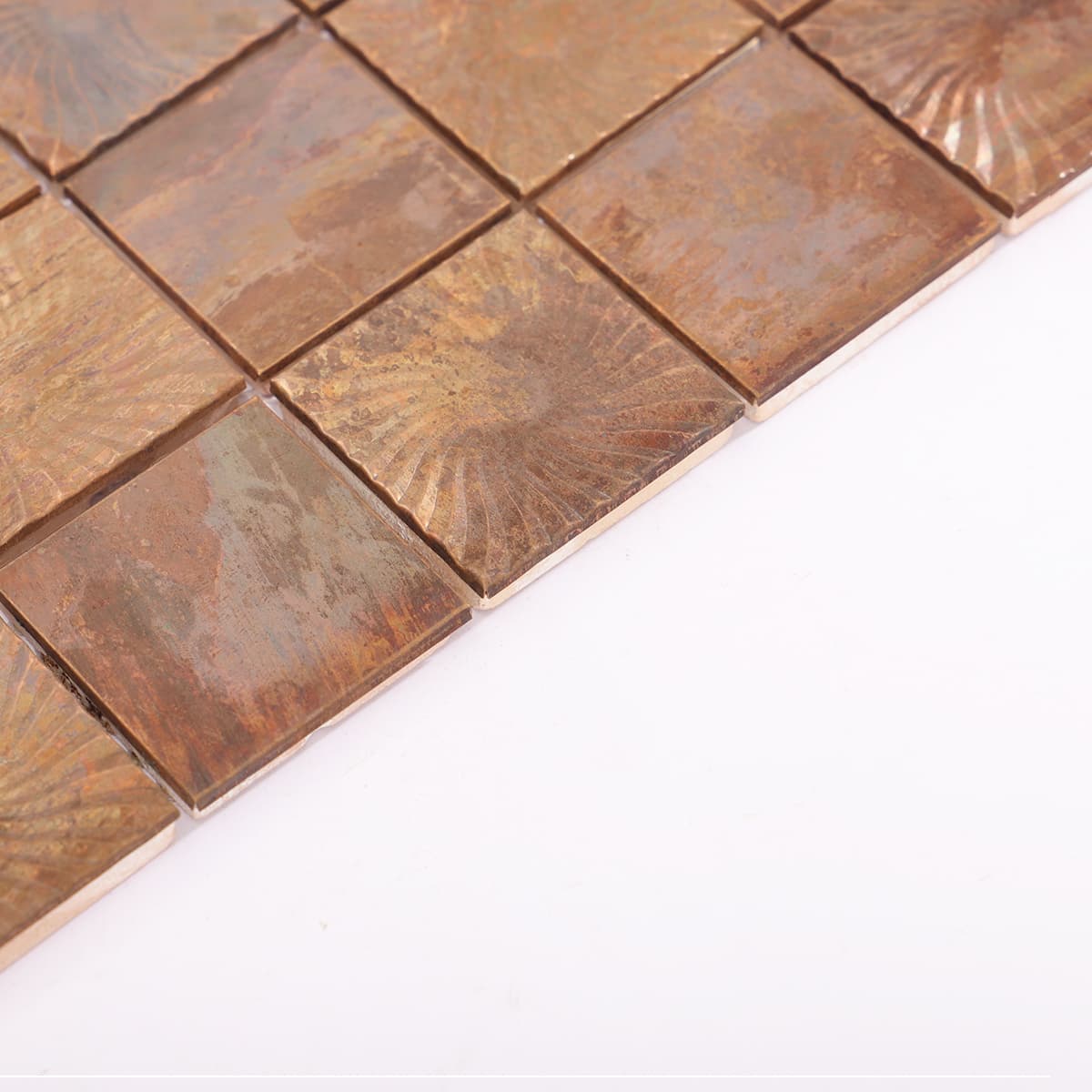 Side view of embossed copper tiles showing natural edge texture