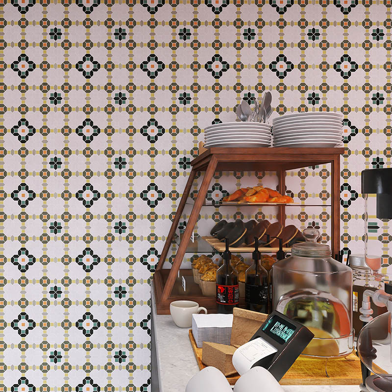 Vintage floral mosaic tile backsplash wall in a coffee shop interior