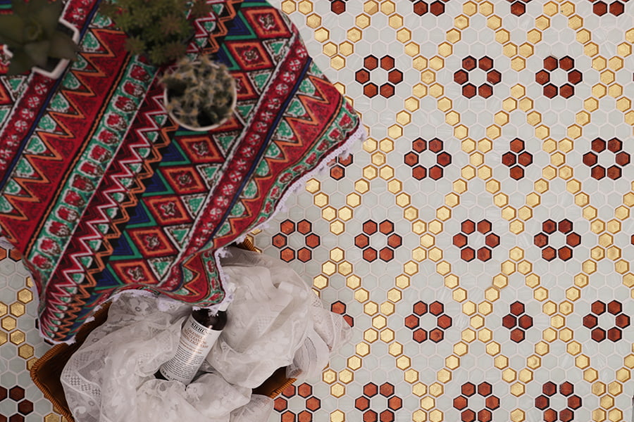 Geometric hexagon tile layout with vintage red and gold glass mosaics