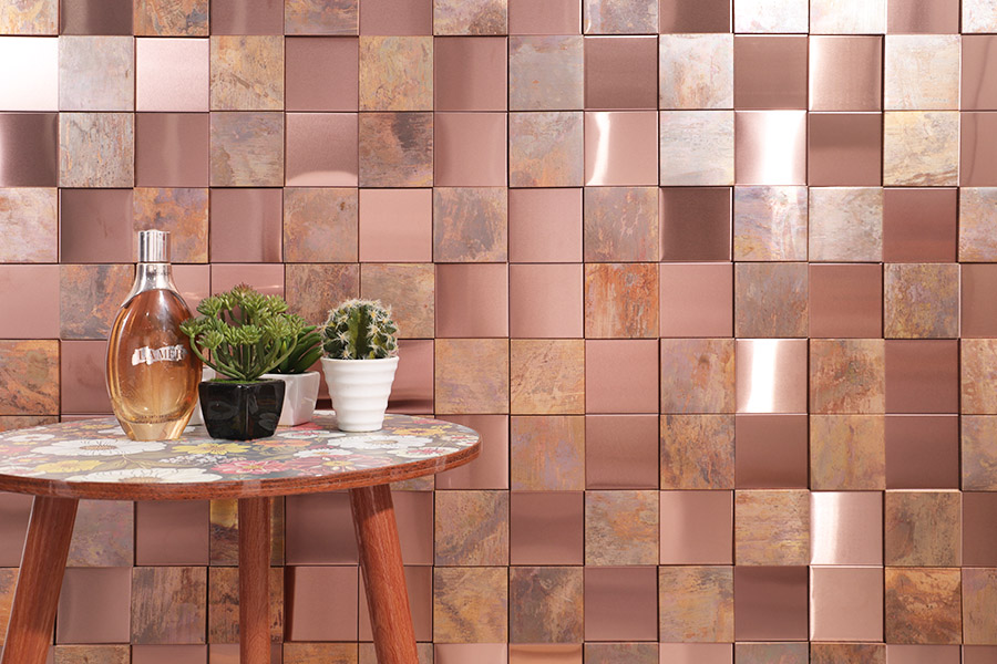Antique style rose gold copper wall tiles featuring a mix of mirror and textured rustic surfaces