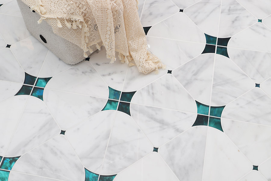 Waterjet marble tile floor in white marble with blue accent inserts