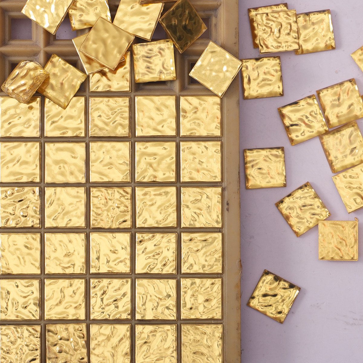 24K gold wave textured mosaic tile panel with scattered loose chips