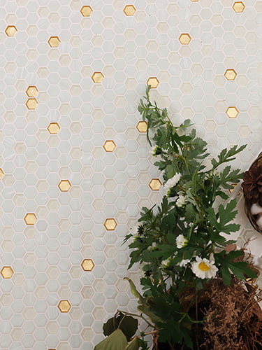 White and gold hexagon mosaic tiles with glass and gold accents, perfect for sophisticated spaces