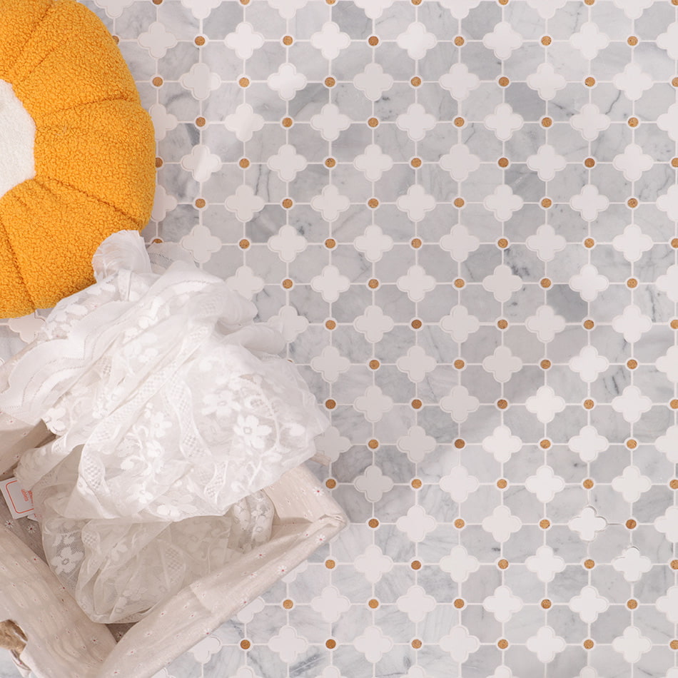 Elegant white and grey marble mosaic floor tiles with small gold dots, decorated 