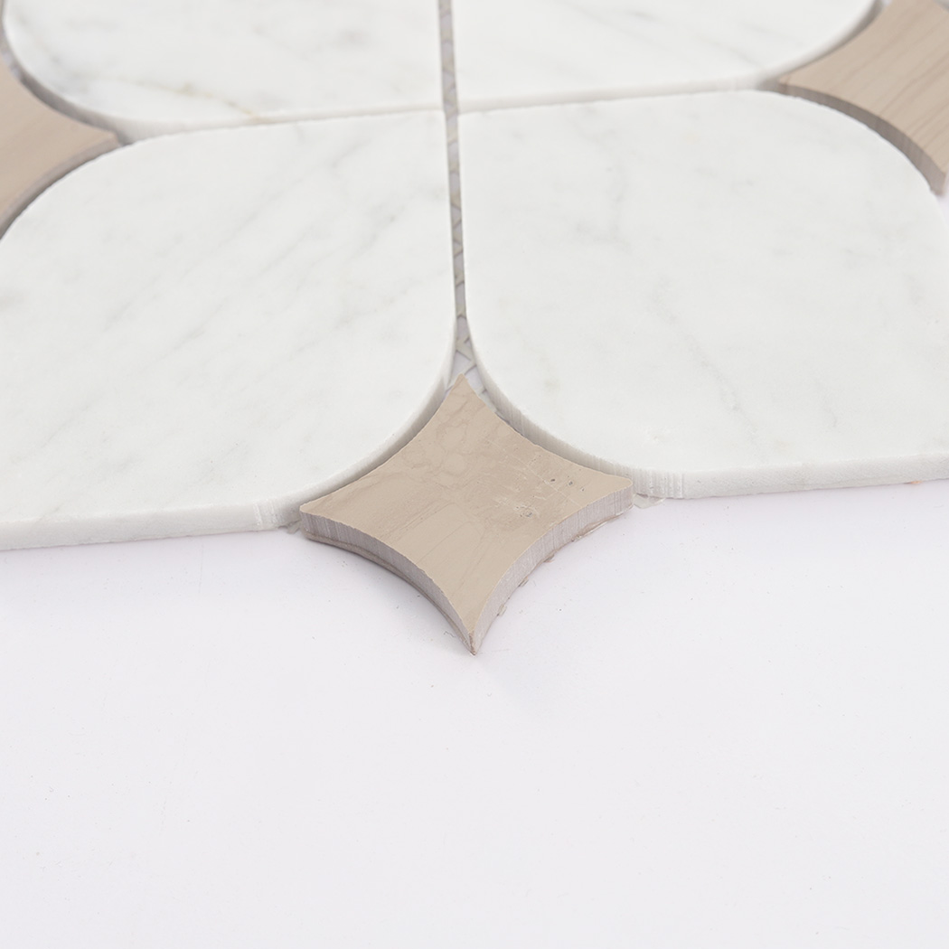 Side close up of white arabesque marble mosaic tile showing thickness and inlay detail