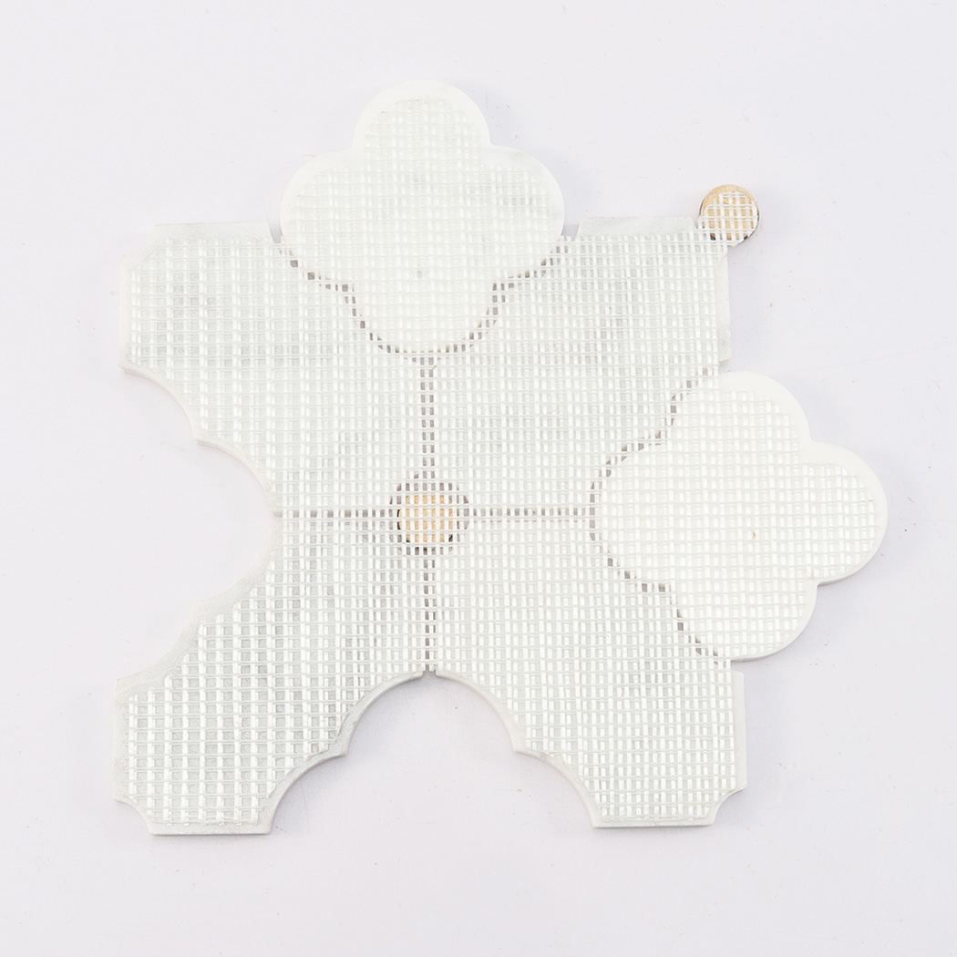 Back view of white arabesque marble mosaic tile with mesh backing