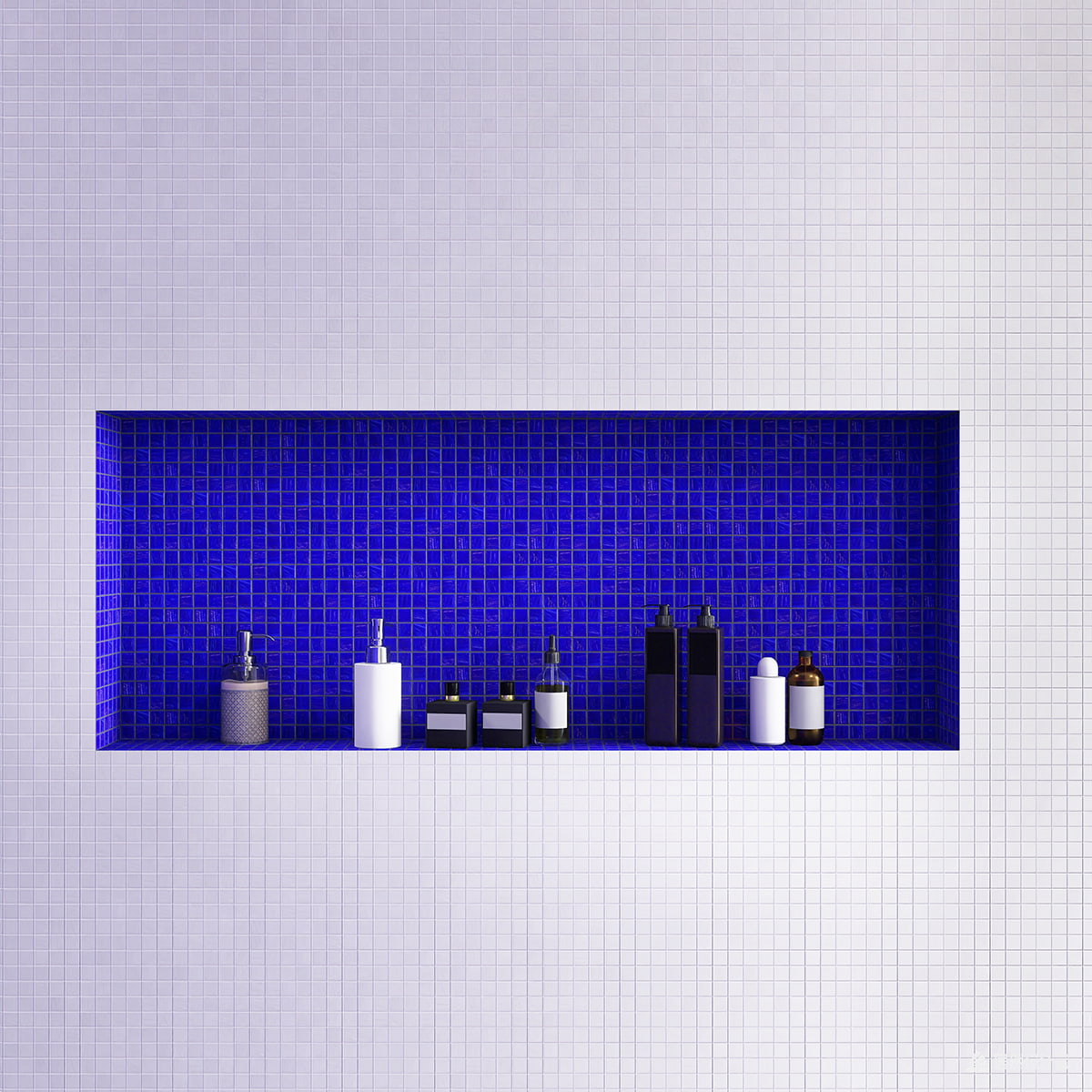 White bathroom with royal blue mosaic niche accent