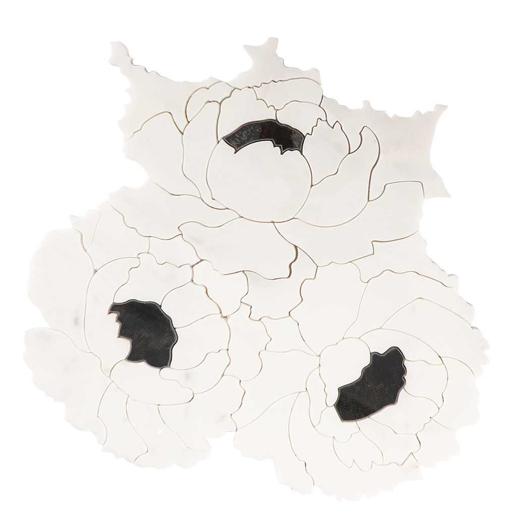 Front view of white flower-shaped marble mosaic tile with black stone accents.