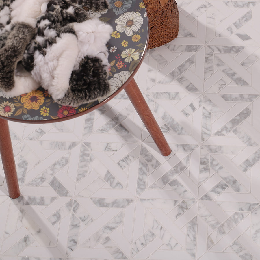 White geometrica Thassos marble tile used as floor with round table décor