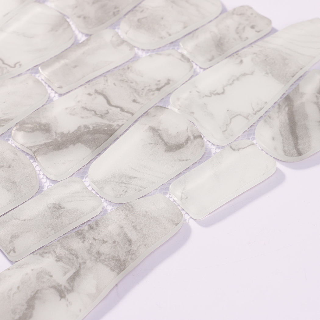 Close-up of mixed white and gray irregular glass mosaic tile pieces