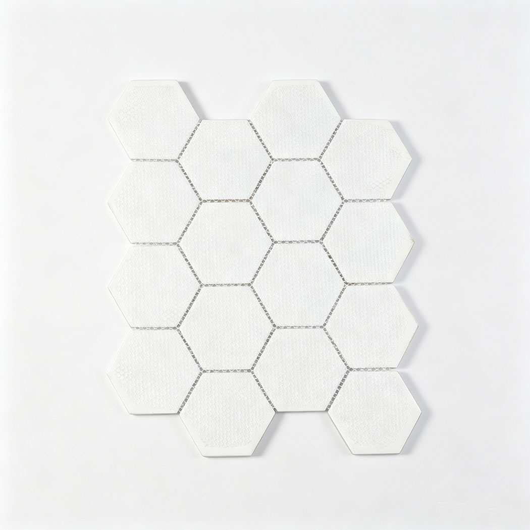 Back view of white hexagon glass mosaic sheet with mesh mounted backing