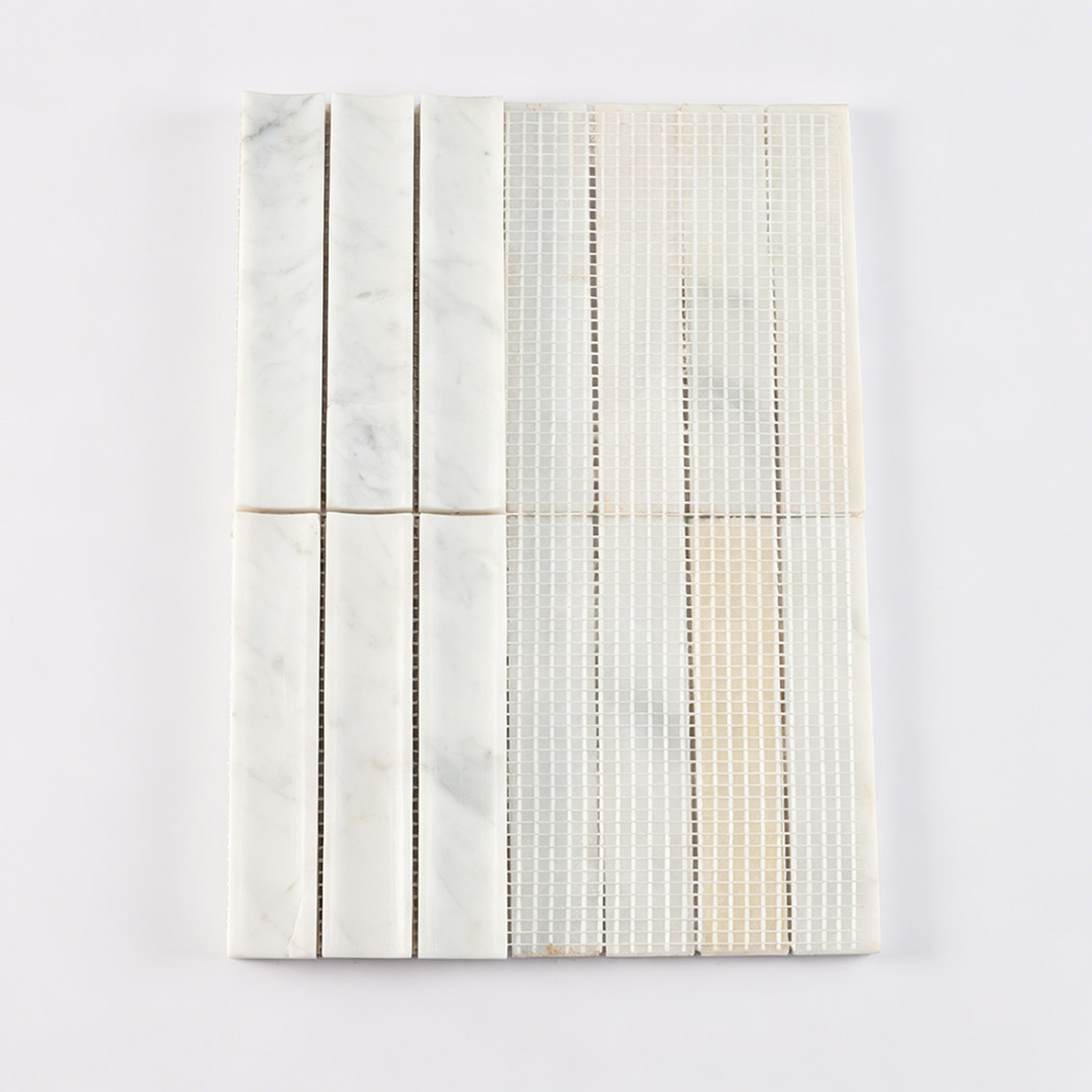 White marble curved fluted mosaic tile showing front strips and mesh backing