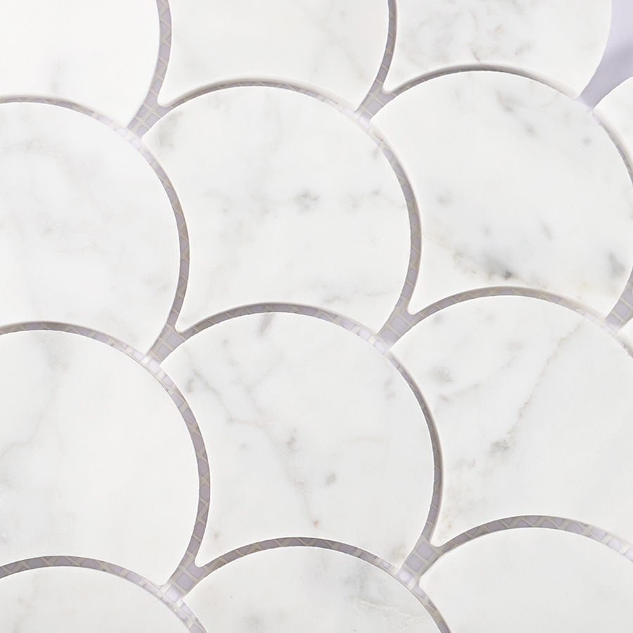 Detailed view of white marble fish scale mosaic pattern showing natural veining.