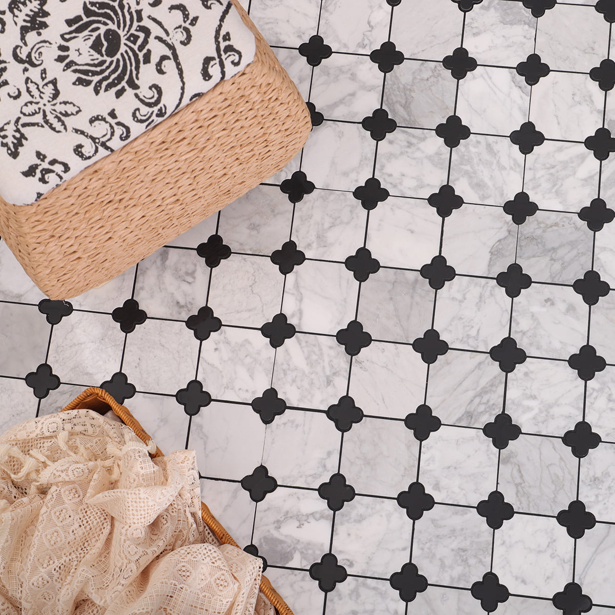 White marble floor with black quatrefoil pattern