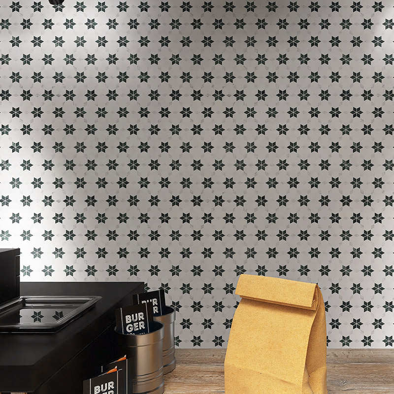 White marble flower mosaic cafe wall with black counter and paper bag
