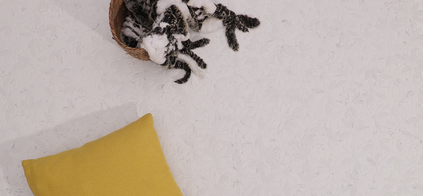 Top view of white floral marble floor tile with cozy decor