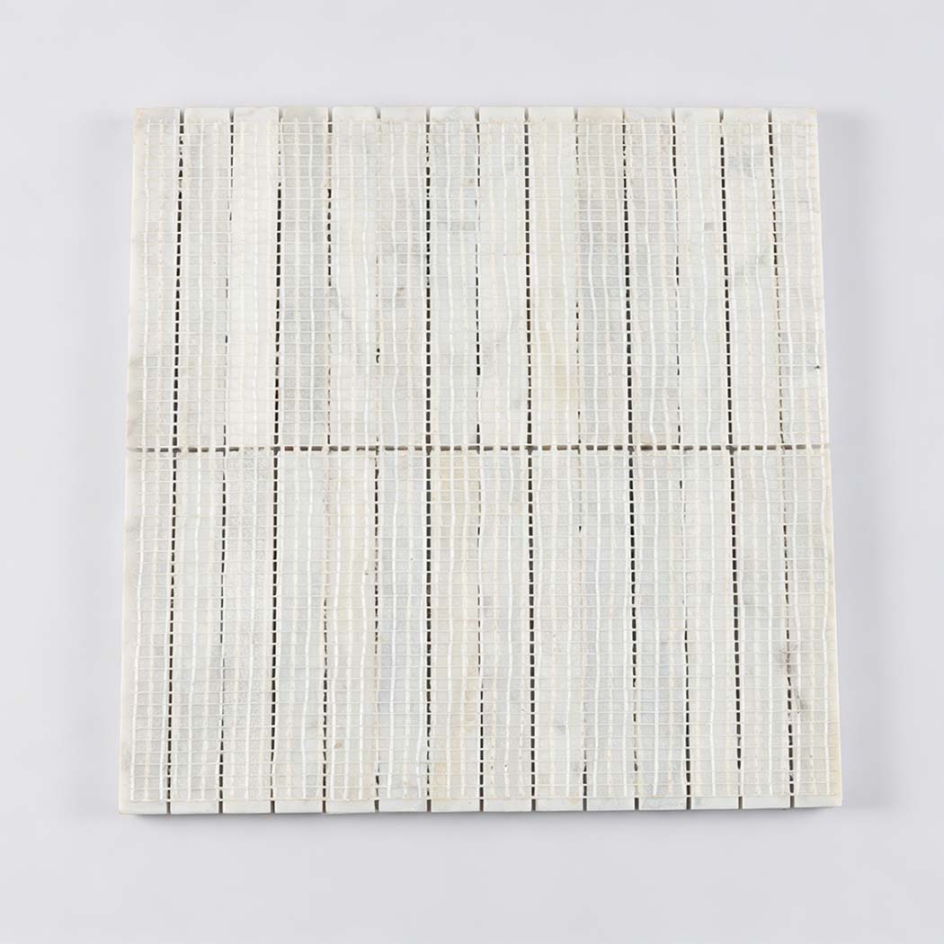 Back view of white marble fluted rod mosaic tile sheet with mesh backing