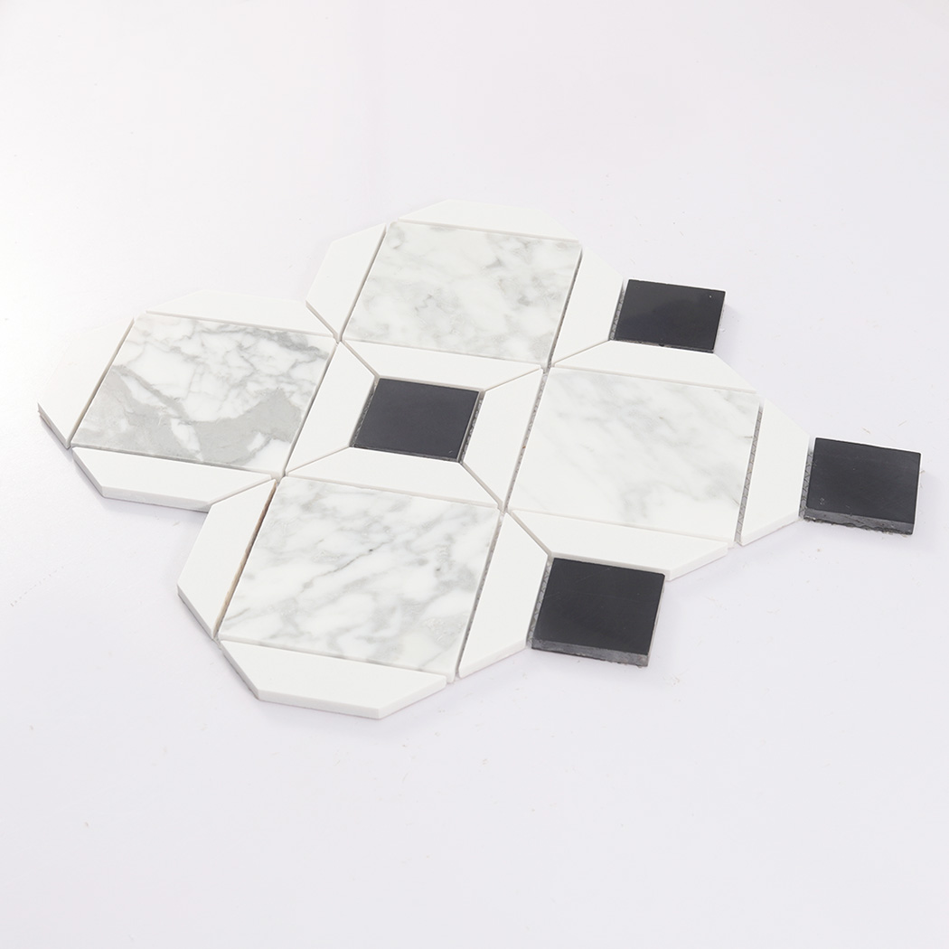 Angled view of white marble geometric mosaic tile with black square accents