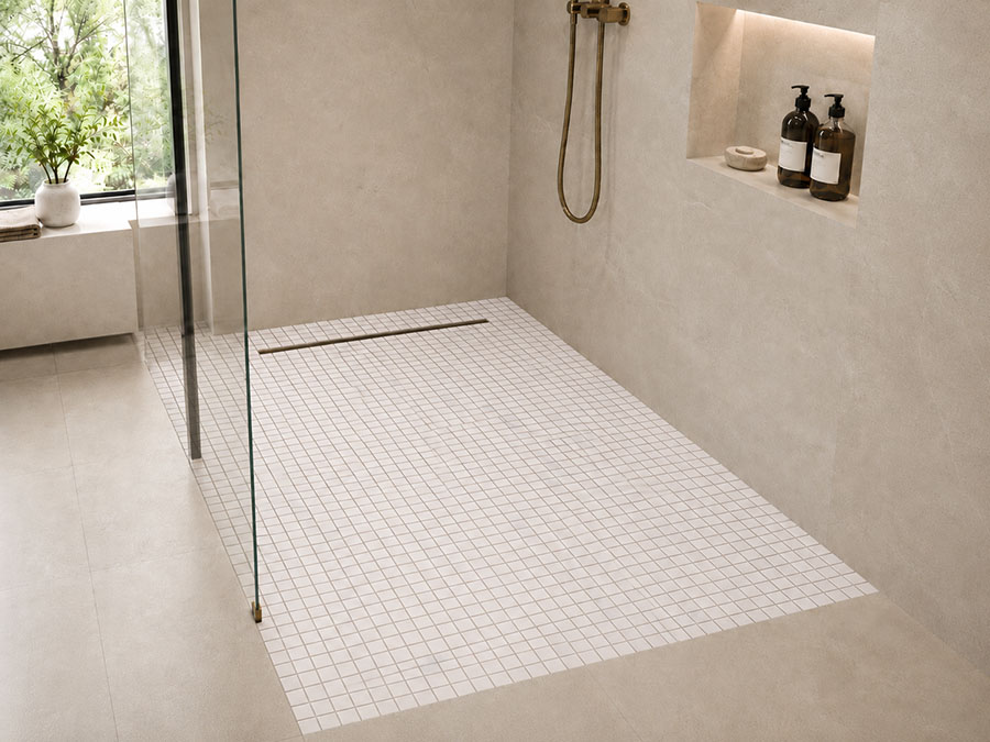 White marble mosaic shower floor tile in a modern bathroom